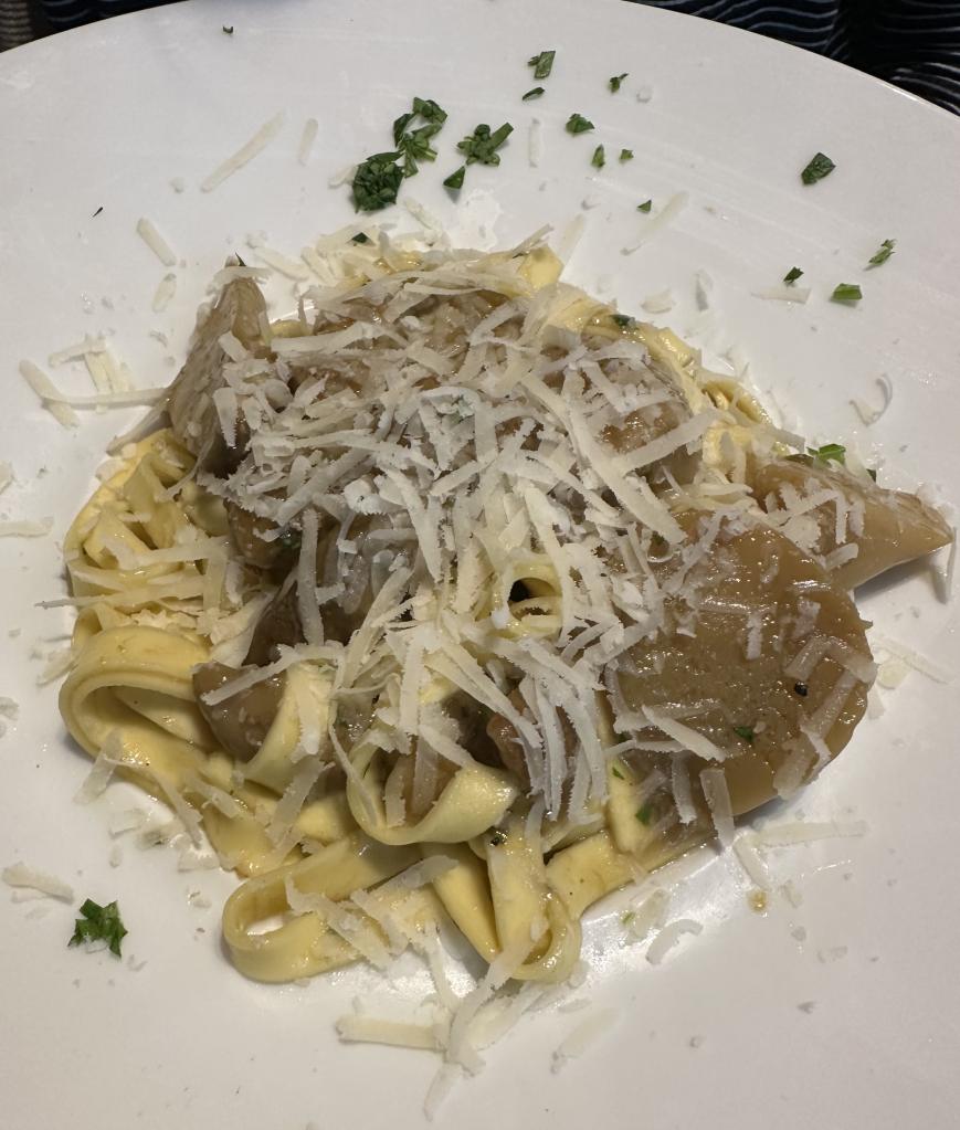 Pasta with mushroom and shredded cheese