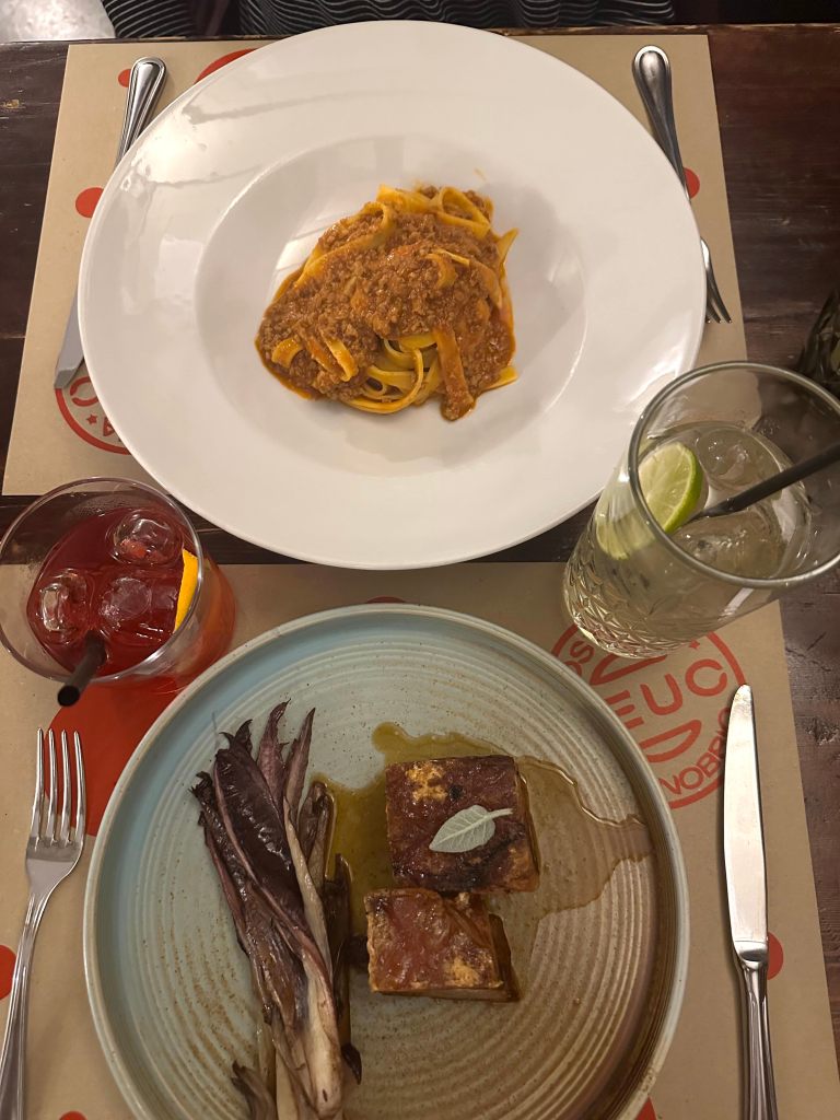 Pasta with meat sauce and crispy pork