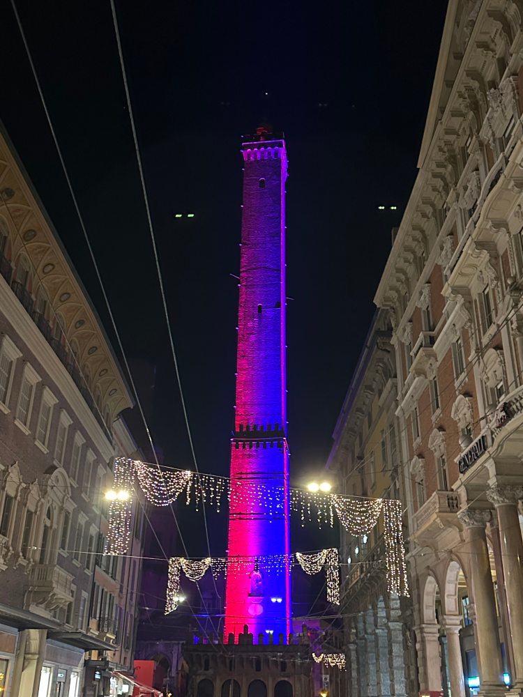 Tall tower in purple light at night