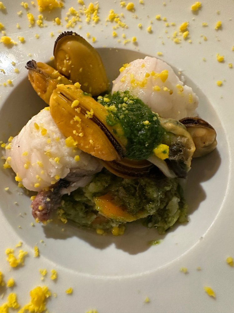 Mixed seafood with mussel, white fish, shrimp, and pesto