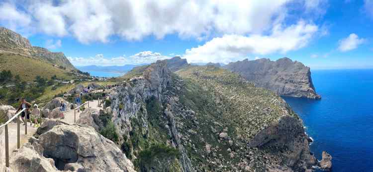 View of cape and water below, with walking path on left side