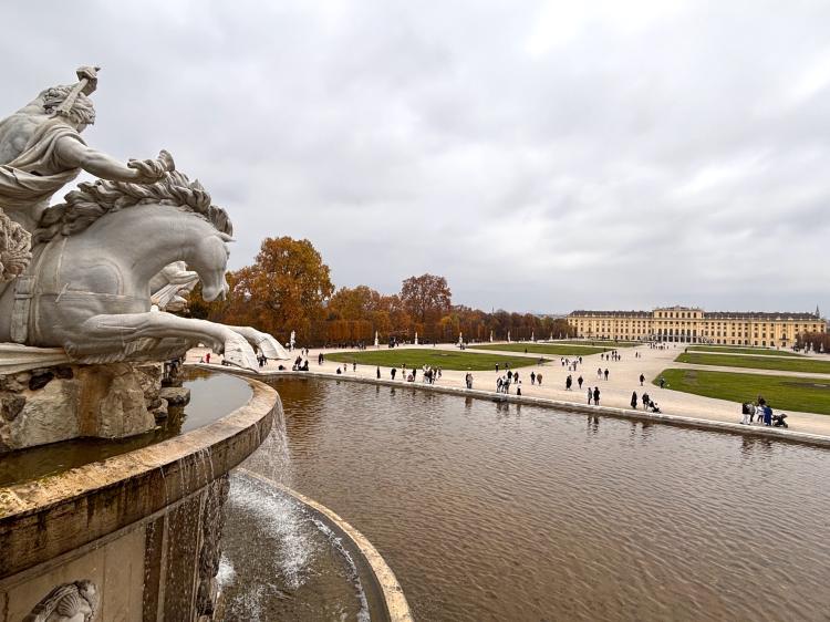 Fountain with horse and Schönbrunn Palace in the background