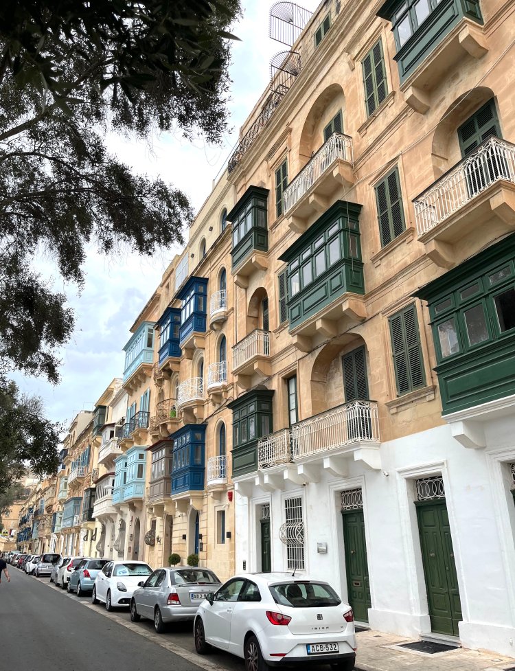 Street view of painted wooden balconies in Valletta