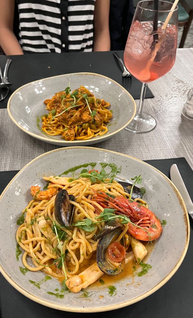 Rabbit spaghetti, Bajtra Spritz, and seafood pasta from Aaron's Kitchen